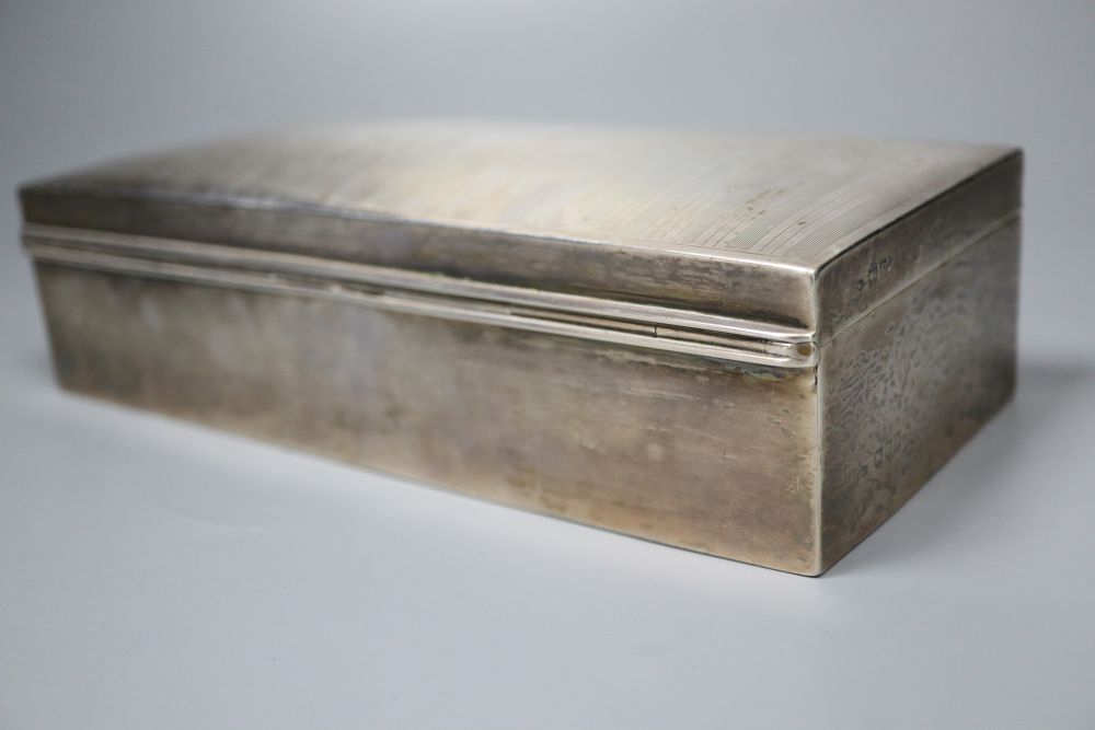 A silver mounted cigarette box. 19.5cm, a silver card case and a tortoiseshell and ivory aide memoir.